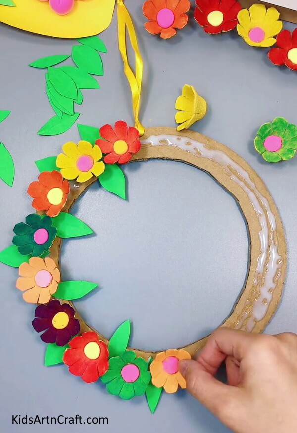 Pasting More Flowers And Leaves - Make Your Own Egg Carton & Paper Flower Wreath for Home Decoration