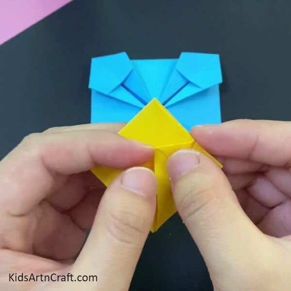 Fold The Upper Sheet Of Square-This tutorial is intended to help kids construct a paper origami basket