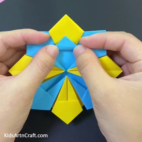 Place The Blue Pattern Above The Yellow One-Teach Your Kids To Make A Paper Origami Basket With This Tutorial