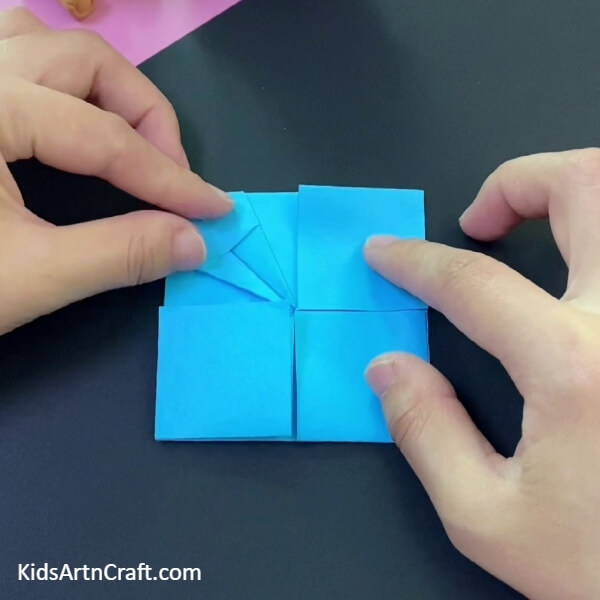 Make One More Fold To Create A Design-This tutorial will teach kids how to make a paper origami basket