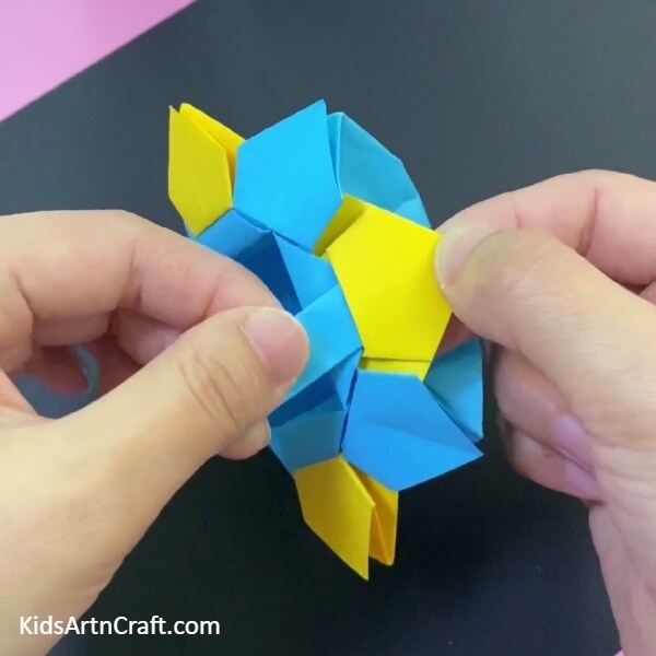 Stick The Other Handle On The Basket-Make your own paper origami basket with this easy-to-follow guide for children. 