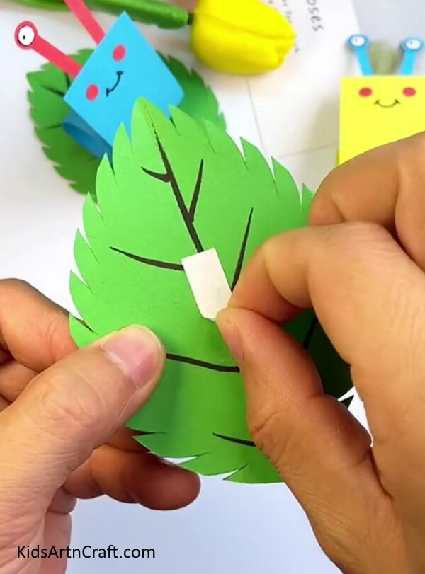 Make a leaf with green craft paper- Put together a paper snail project for your toddler to do in the house.
