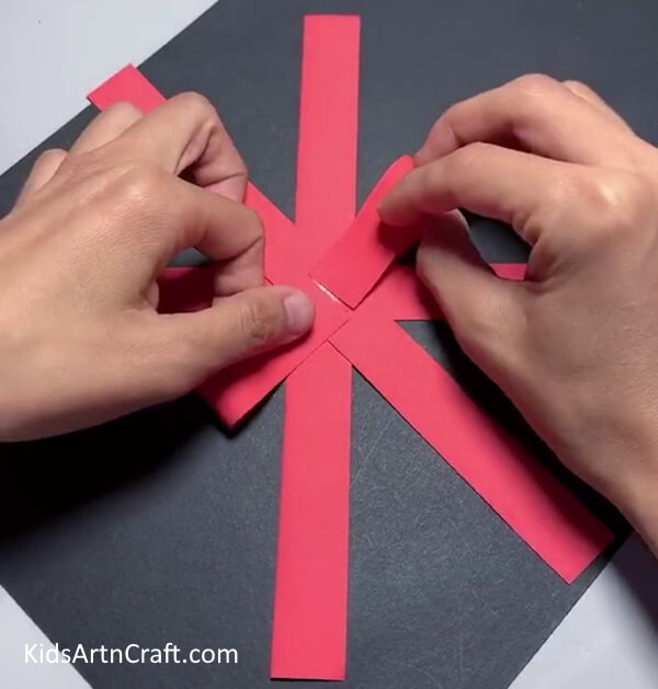 Applying Glue At The End Of Each Pieces- Paper Strips Flower Creation: A Step-by-Step Guide 