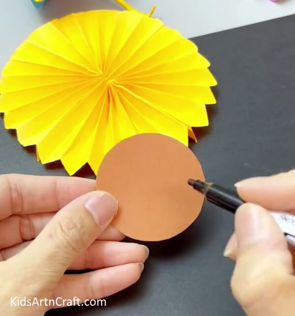 Cutting A Brown Circle - Do-It-Yourself Sunflower Art and Crafts for Children