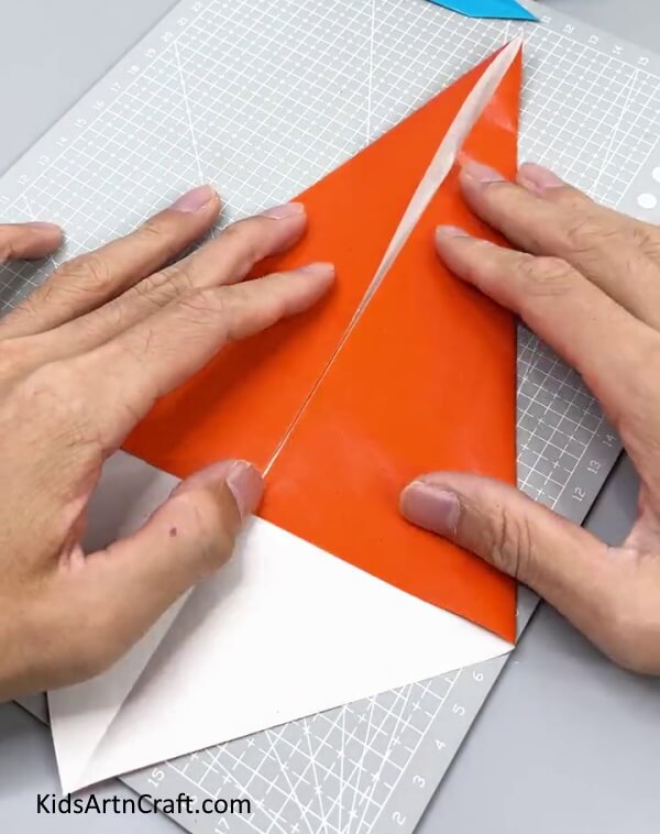 Folding The Gloss Paper - How to Create a Paper Sword for Kids: Step-by-Step Guide