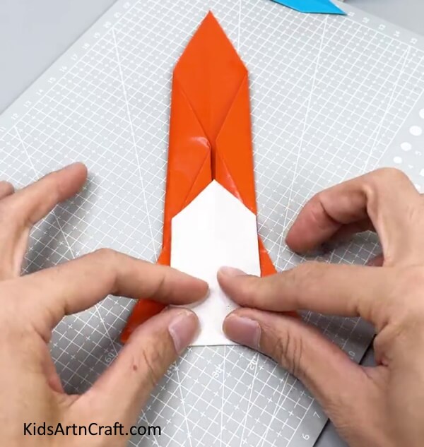 Folding The Tail Of The Sword - Making a Paper Sword for Kids: Step-by-Step Tutorial