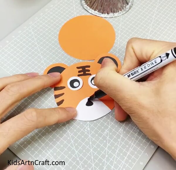 Drawing Tiger Patterns And Tiger's Mouth Creating a paper tiger wall hanging with no difficulty through a DIY project.
