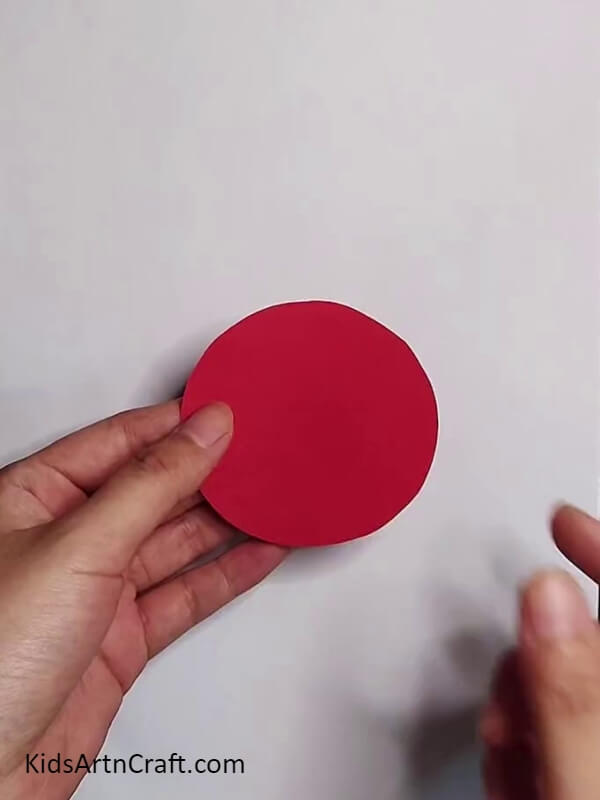 Make a Circle With Red Craft Paper - Making a Watermelon Windmill - A Breeze!