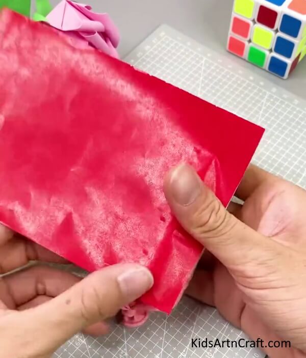 Wrapping Red Paper - This tutorial offers an easy way to construct a party popper 
