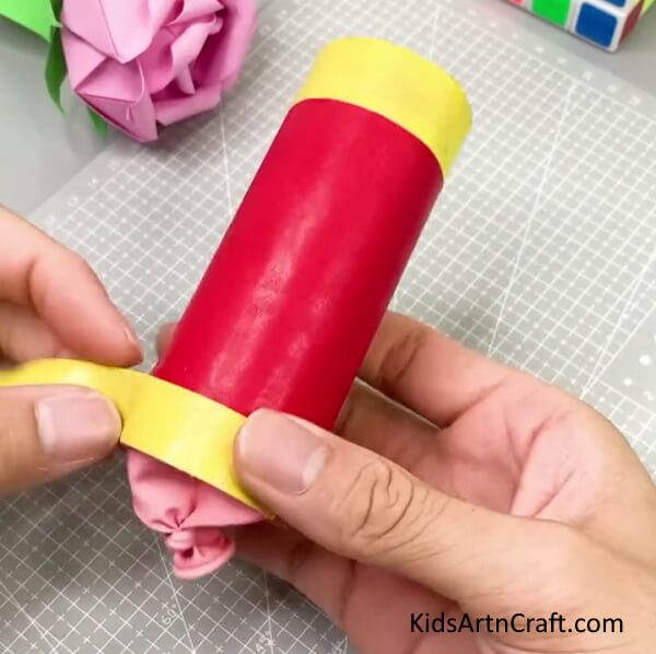 Wrapping Yellow Strip At the Bottom - Step-by-step guide to building a party popper for a celebration