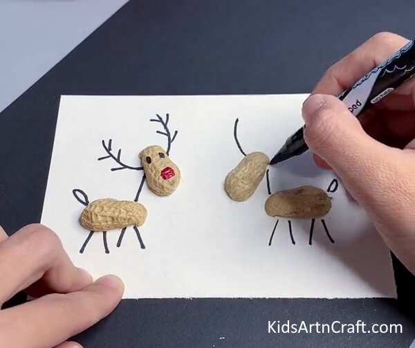 Making Another Reindeer - Put together a Reindeer with peanut shells for the little ones.
