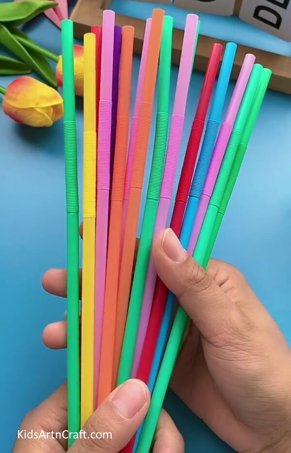 Getting Colorful Drinking Straws-Make your own pencil holder from plastic bottles and pipe cleaners.