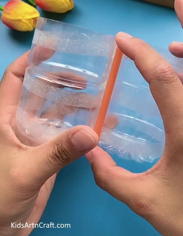 Pasting Half Of The Straws On Bottles- Utilize plastic bottles and pipe cleaners to make a pencil holder.