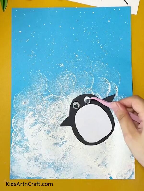 Stick Googly Eyes-Kids can follow this tutorial to make a penguin craft. 