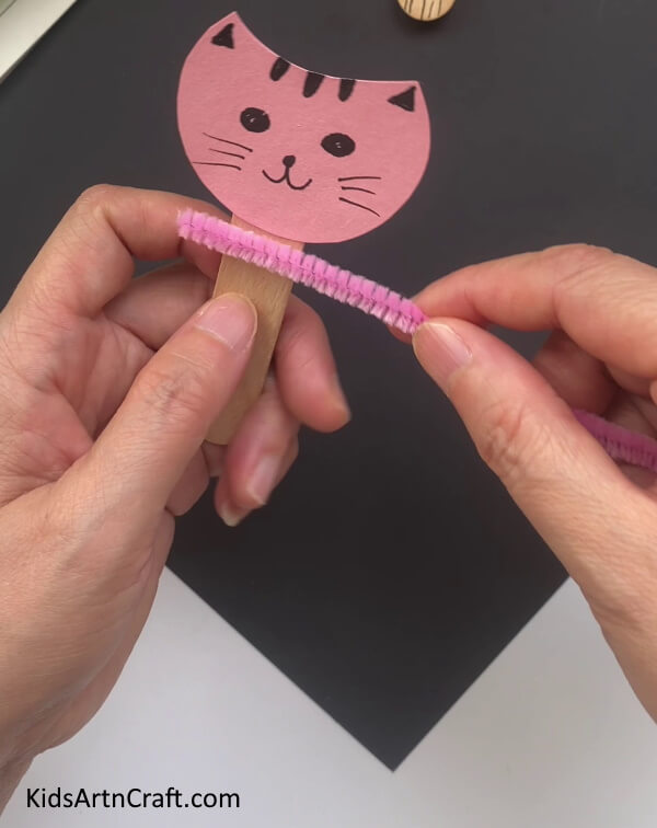 Pasting Pink Pipe Cleaner Around Stick DIY Cat Craft Tutorial - Popsicle Sticks and Pipe Cleaners