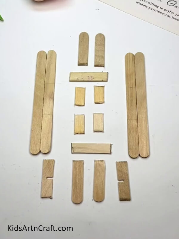 Cutting the ice cream sticks into different shapes - Guide to Making Toys with Popsicle Sticks for Newbies