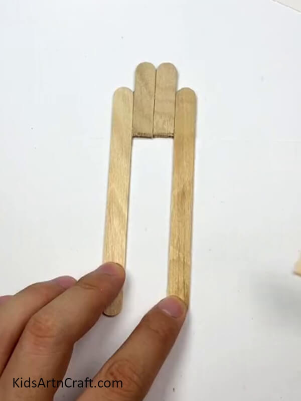 Placing the sticks together - A Step-by-Step Guide to Creating Toys with Popsicle Sticks