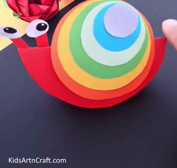 Your Rainbow Snail Is Ready! - Make a paper snail craft with all the colors of the rainbow for kids.