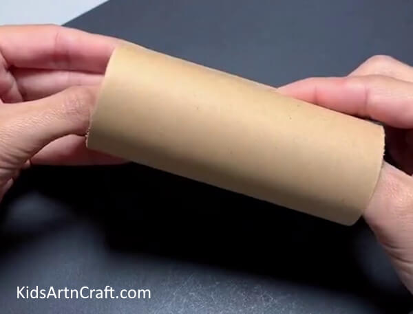 Taking A Cardboard Roll - Create a fun reindeer puppet Christmas craft with a cardboard roll!