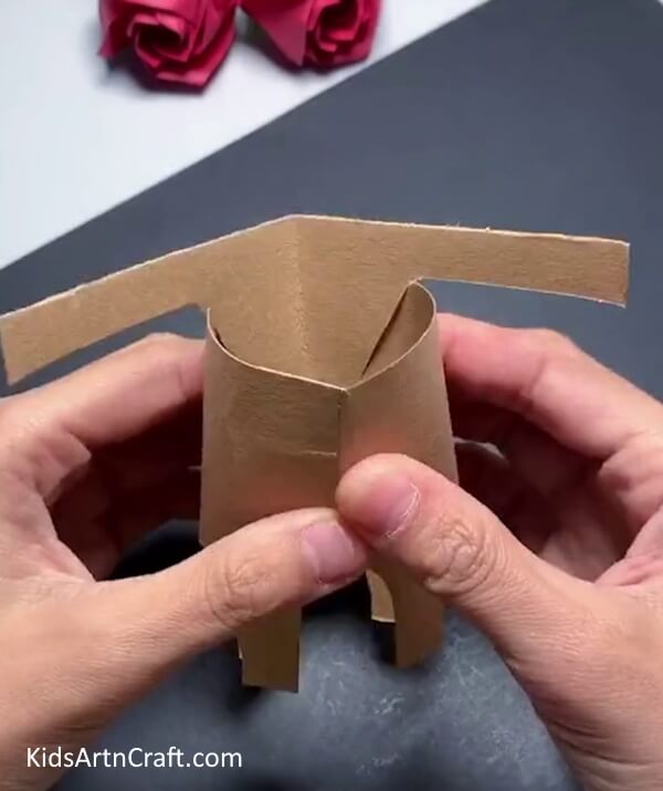 Paste The Double-sided Tape - Put together a reindeer puppet Christmas craft utilizing a cardboard tube!