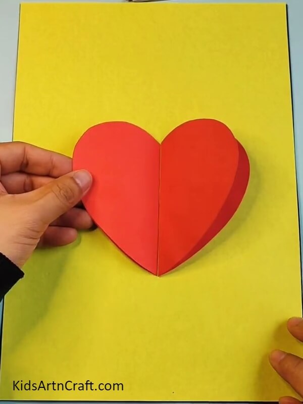Create One More Heart And Paste It On Yellow Color Craft Paper- How To Make A Strawberry Craft By Oneself - A Tutorial For Beginners