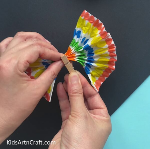 Attaching Pleats With Paper Clip - Transform Tissue Paper into a Butterfly Craft for Kids