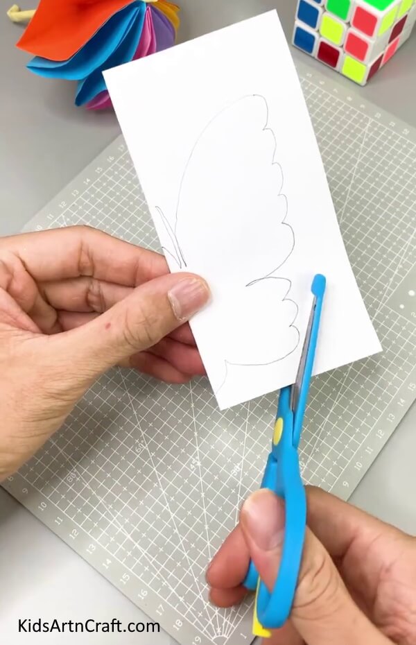 Cutting Out The Butterfly - DIY Butterfly Paper Art For Kids To Make At Home