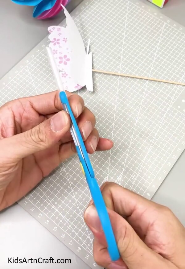 Cutting A  Straw - Home-Made Butterfly Paper Craft For Kids To Make