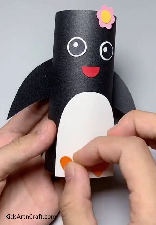 Adding A Flower And Making Feet-Utilizing a cardboard tube, preschoolers can build an adorable penguin. 