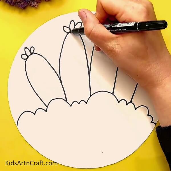 Making some leaves on the carrots- Drawing Carrots - A Step-by-Step Guide for Kids
