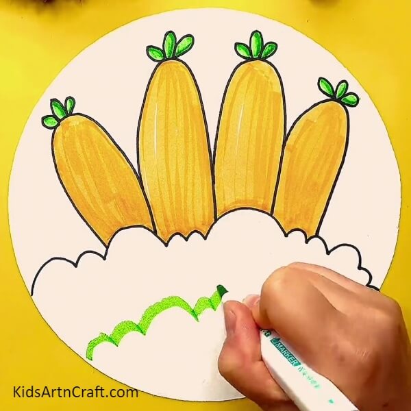 Colouring the leaves- Carrot Drawings - An Easy Step-by-Step Guide for Kids