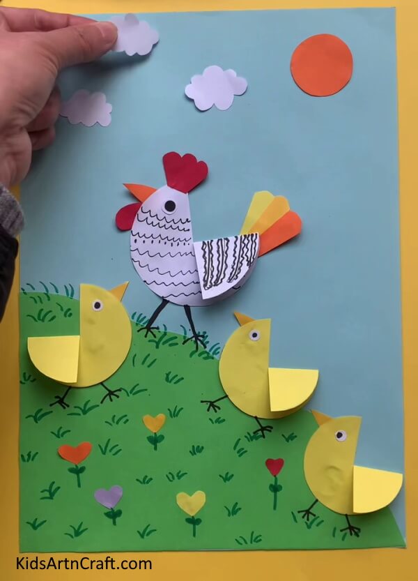 Pasting The Sun And Clouds  A straightforward chicken-related art and craft experience for kids
