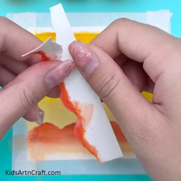 Tear the already torn paper- Tutorial For Kids to Paint a Sunset Easily