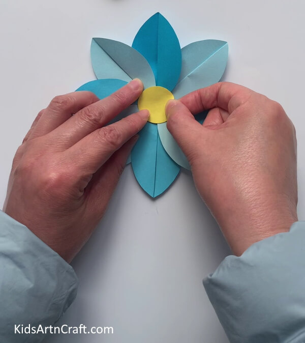 Pasting A Yellow Circle At The Center- Developing flowers with craft paper for the young ones