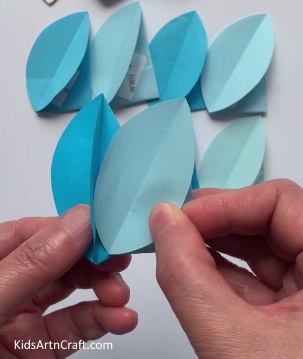 Attaching Two Petals Together - Utilizing craft paper to make simple blossoms for children