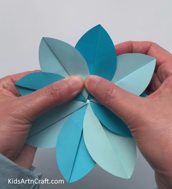 Attaching All The Petals- Making use of art paper to form flowers for children