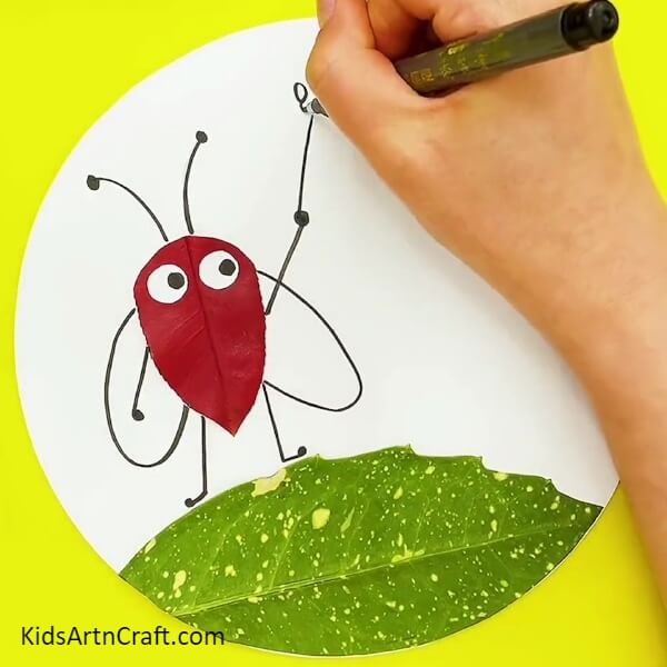 Adding Arms To The Insect- A Step-by-Step Tutorial on Crafting an Insect with Leaves for Kids 