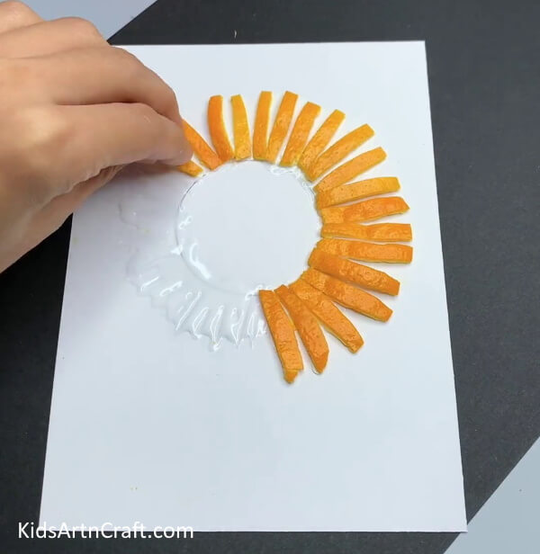 Pasting Orange Peel Strips- A child can make a lion using an orange peel with ease. 