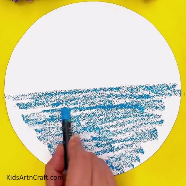 Making water of the river using blue crayon Creative Art Projects for Youngsters Featuring Mountain and Ocean Scenes 