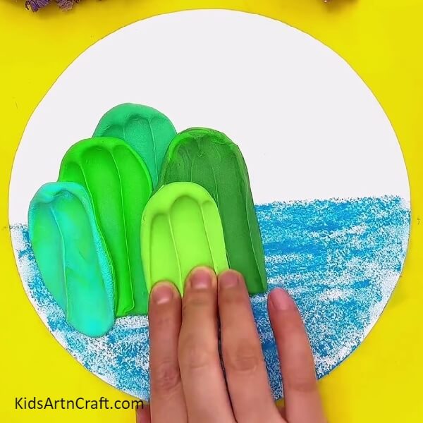 Making more mountains with the modeling clay- Fun Art Projects for Children Including Mountain and Ocean Vistas 