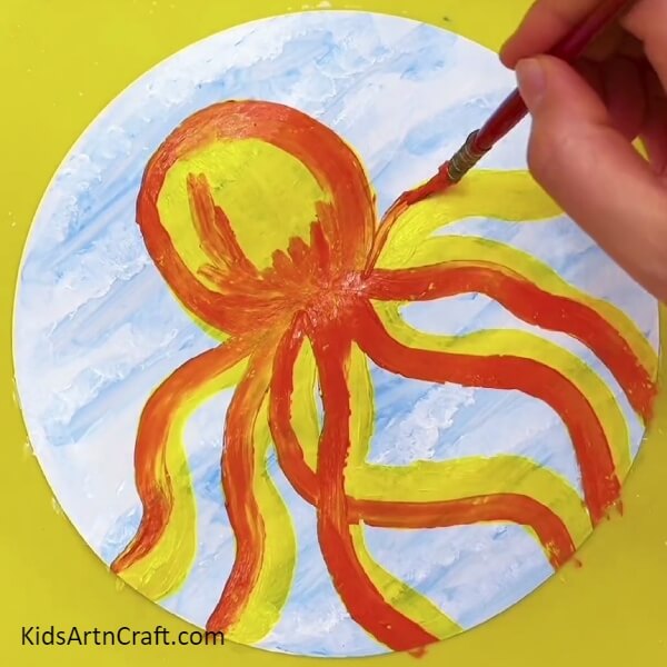Outline The Legs Of The Octopus Using Red Paint And Paintbrush-