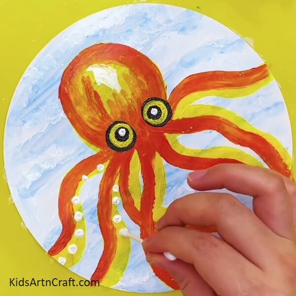 Using A Cotton Bud And White Paint Make Tiny Circles On The Legs Of The Octopus-