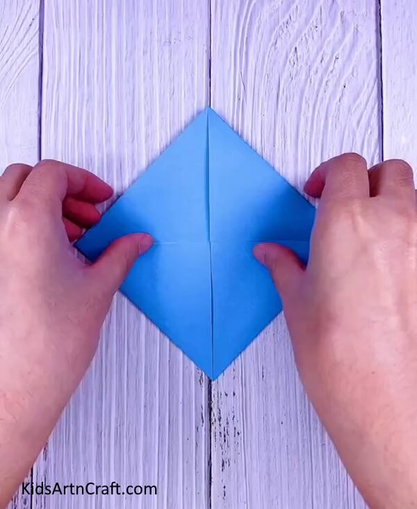 Fold all the other edges of the paper inwards too- Learn how to craft origami Paper Paku Paku with this step-by-step tutorial.