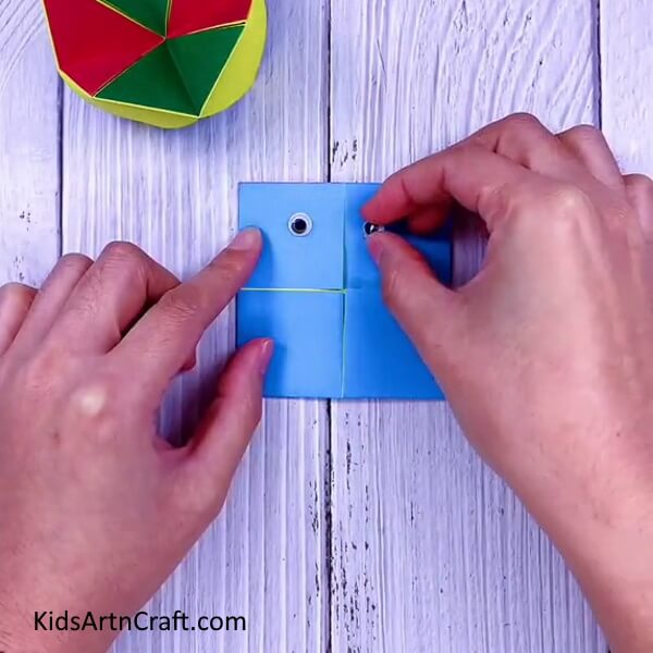 Paste the googly eyes or craft eyes- A tutorial designed to make origami Paper Paku Paku simple for children.