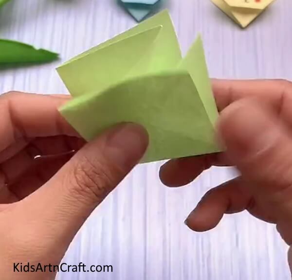 Squash Folding The Corners-How to construct a Rabbit Face out of Origami for kids.