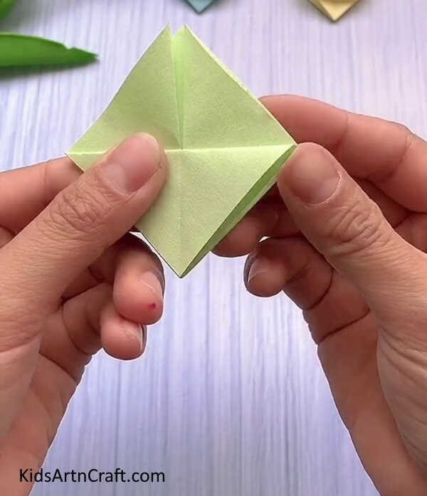 Folding Along The Crease- A step-by-step guide to creating a Rabbit Face with Origami for young ones.