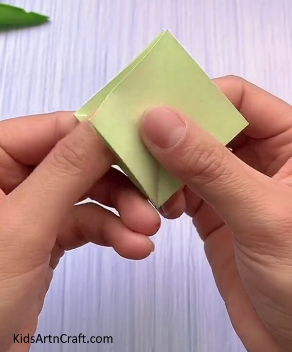 Folding The Diamond To The Adjacent Side-A child-friendly tutorial to form a Rabbit Face with Origami.