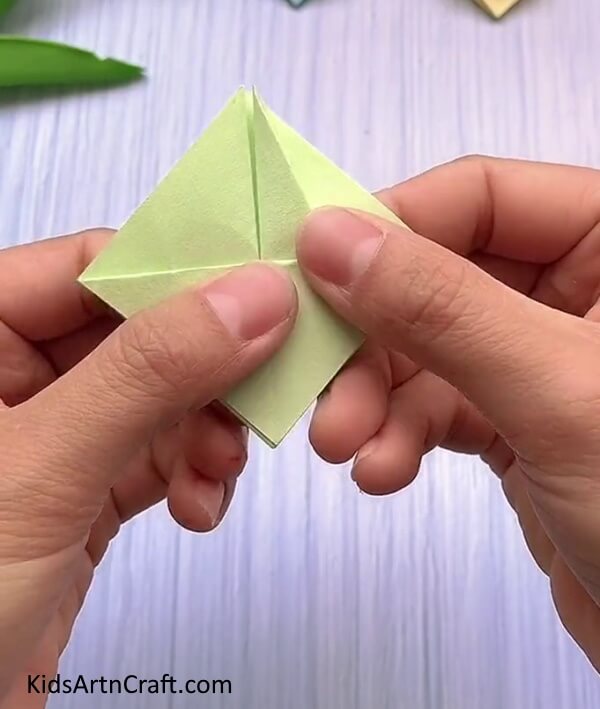 Unfolding Back To The Diamond- An easy-to-follow guide to making a Rabbit Face with Origami for children.