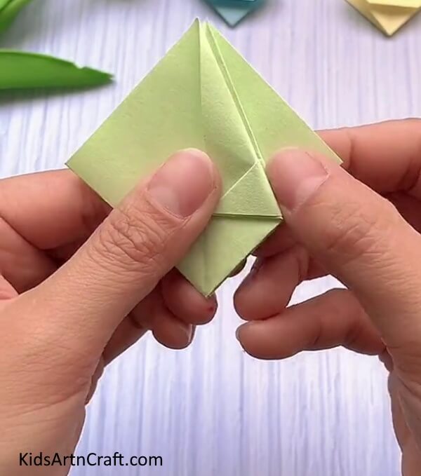 Folding The Corner To The Crease-A kid-friendly guide to constructing a Rabbit Face with Origami.