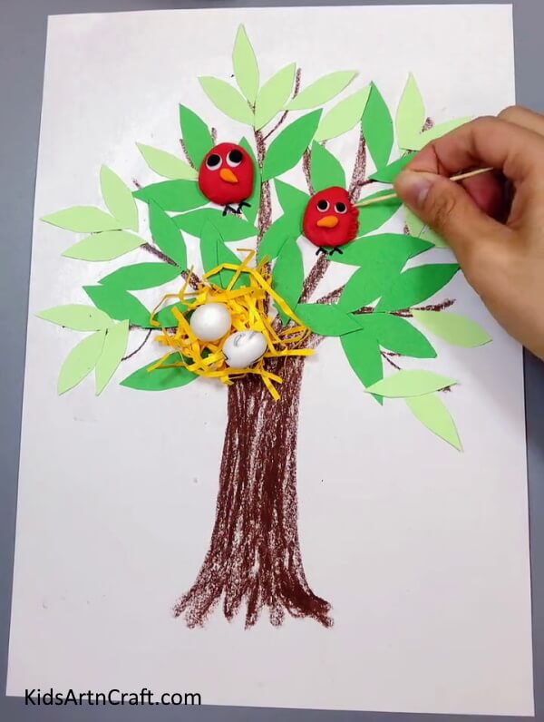 Making Birds Using Clay - A straightforward paper-crafted tree with a bird nest for young ones